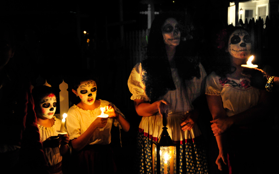 People in painted skull face for Day of the Dead