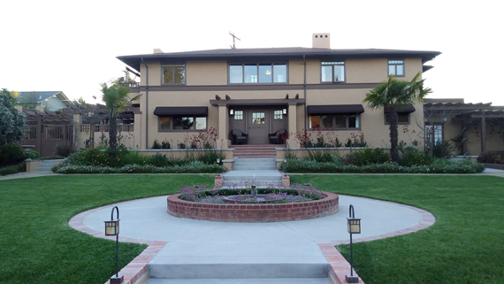 Street view of the restored 1905 Alice Lee/Irving J. Gill/Hazel Wood Waterman House with restored fountain.