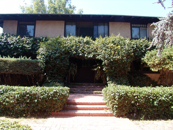 Street view of the overgrown Alice Lee House, 3574 Seventh Avenue, before July 2014.