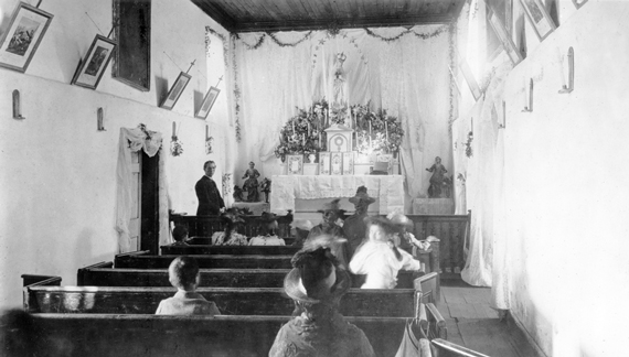 Interior of the Adobe Chapel, c. 1890 with the Immaculate Conception statue in place.