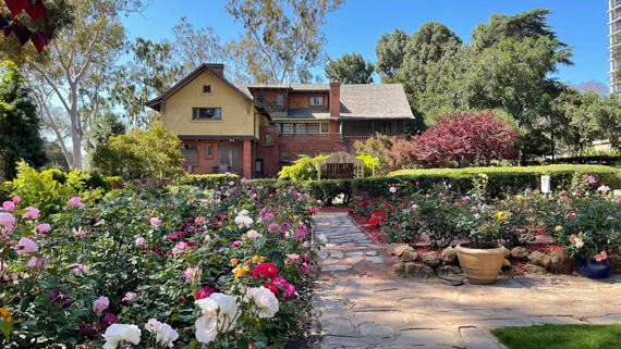 Photo of the Marston House Museum with the formal gardens in the foreground.