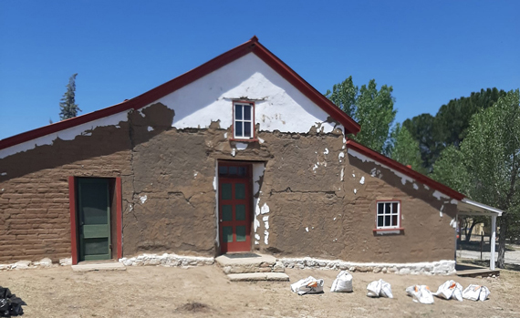 Photo of adobe repairs in process.