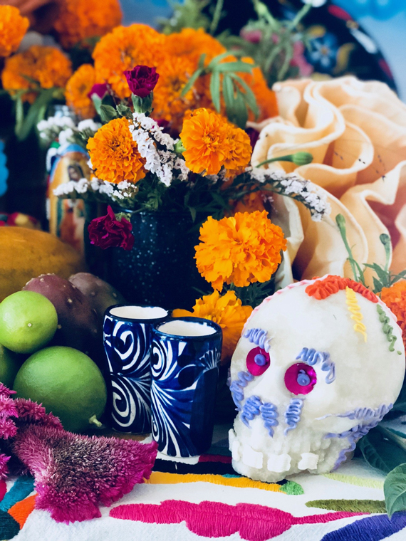 Day of the dead altar with sugar skull and marigolds