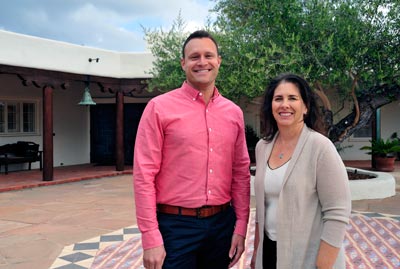 Joseph Reid & Ione Stiegler in front of the University House