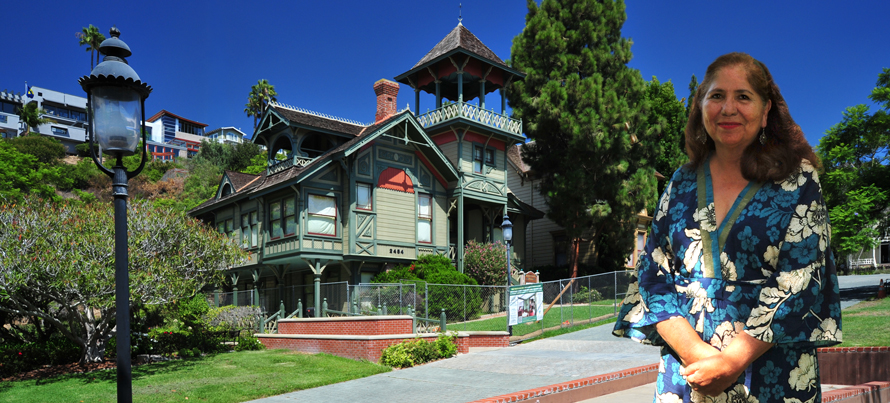 Maria Curry standing in front of the Sherman-Gilbert House in Heritage Park